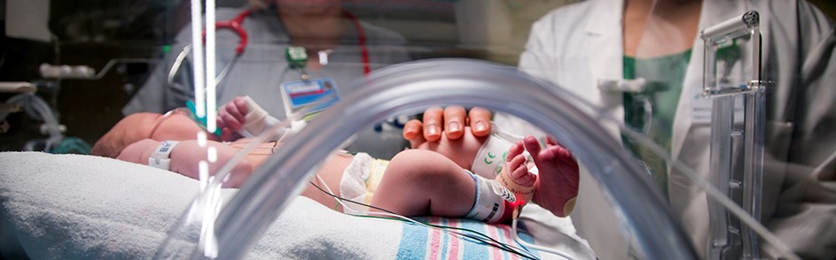 A baby in the Lima Memorial neonatal nursery