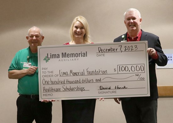 Auxiliary presenting check to Lima Memorial Foundation